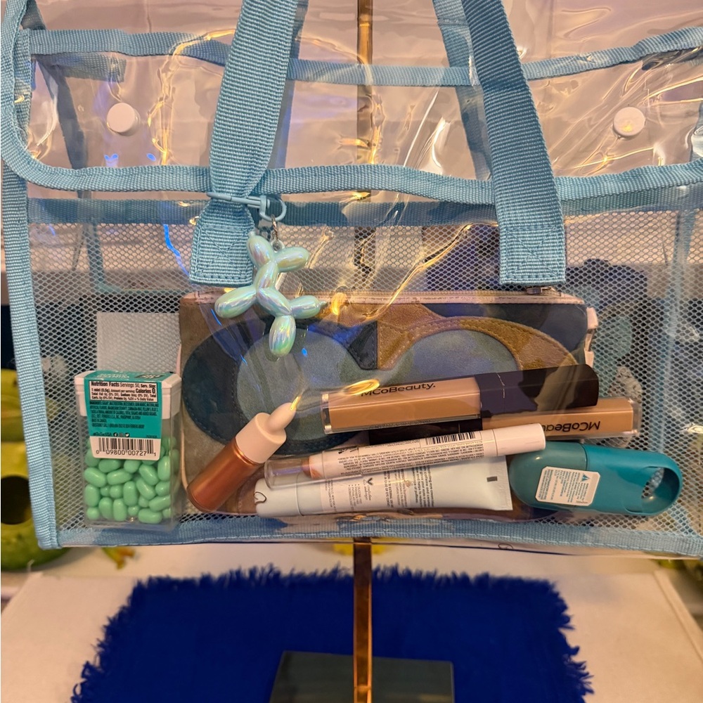 Brand new. Transparent, very thick and durable Tote with Blue Trim